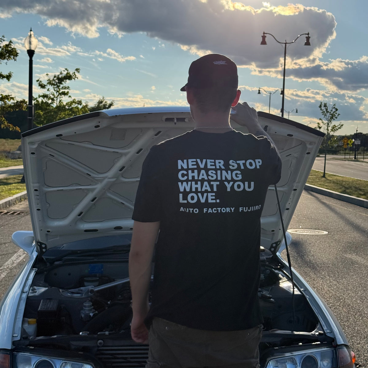 NEVER STOP CHASING WHAT YOU LOVE Tee — Black or White
