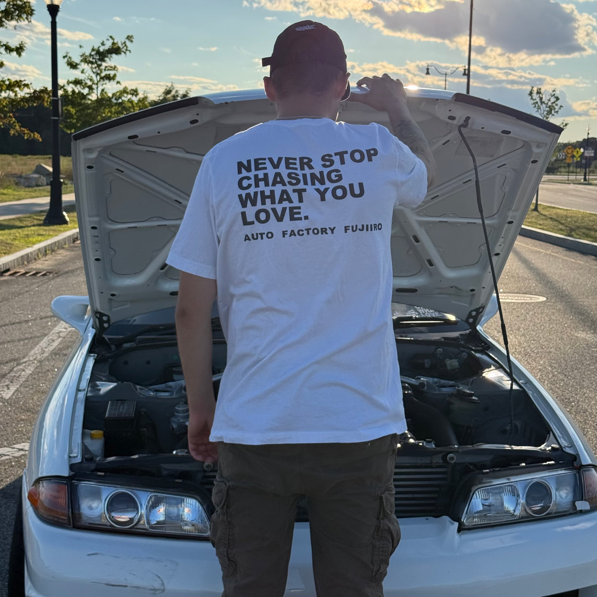 NEVER STOP CHASING WHAT YOU LOVE Tee — Black or White
