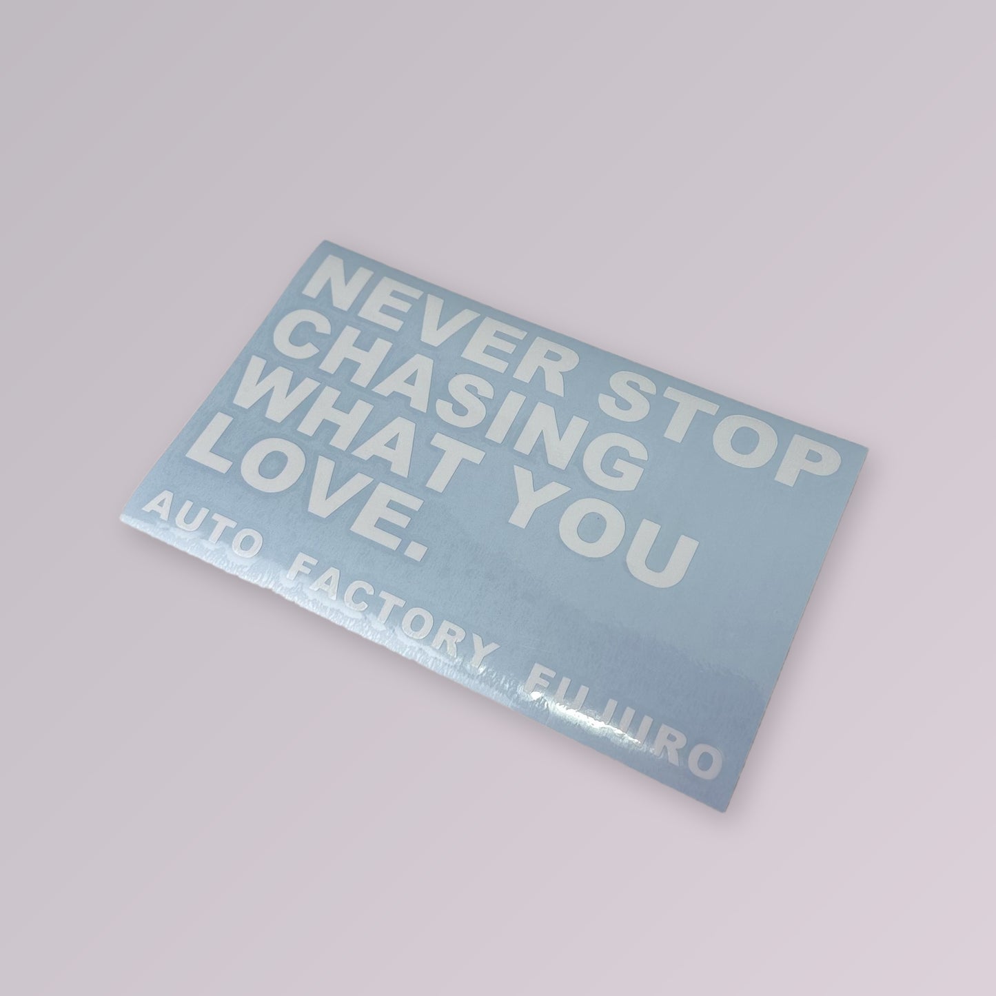 NEVER STOP CHASING WHAT YOU LOVE decal on transfer sheet, angled view